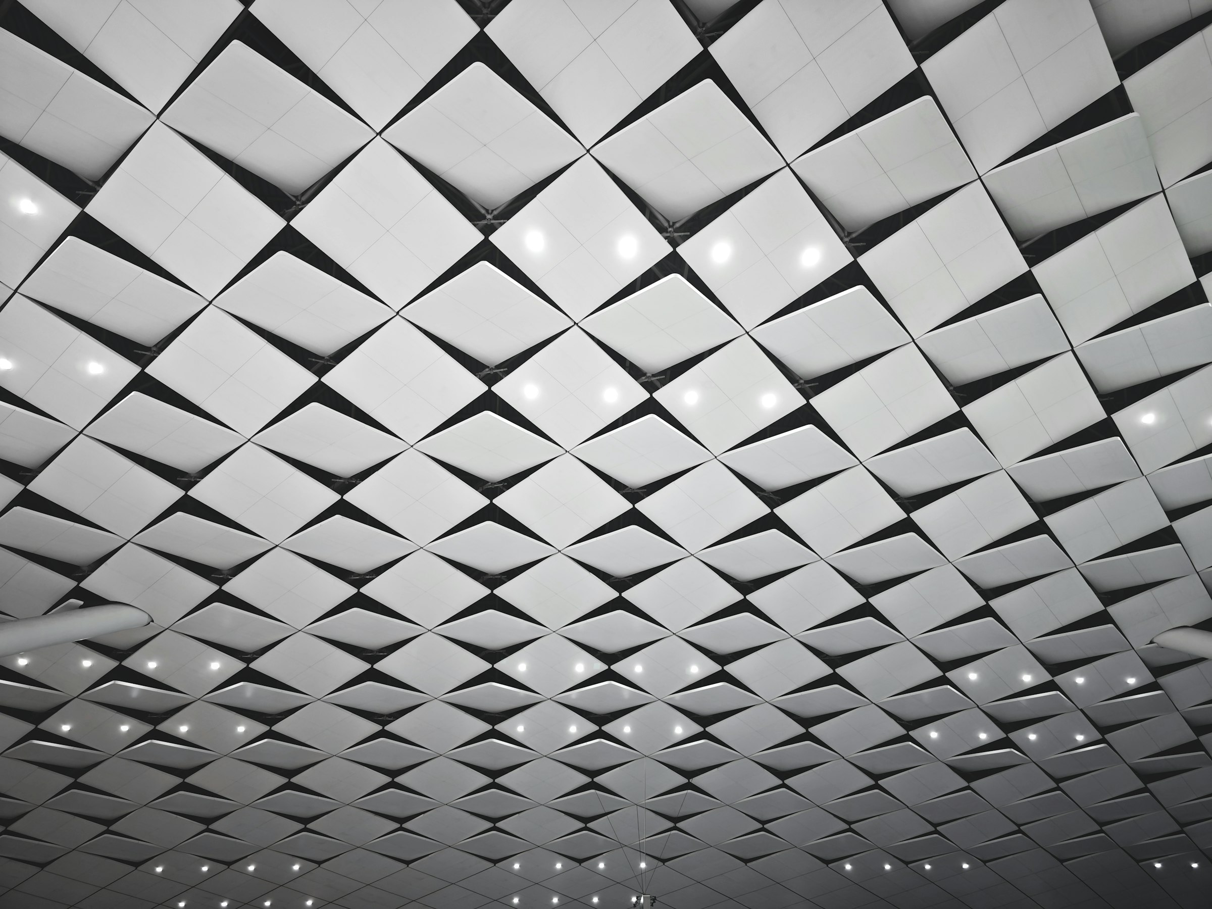 A ceiling of repeating acoustic panels